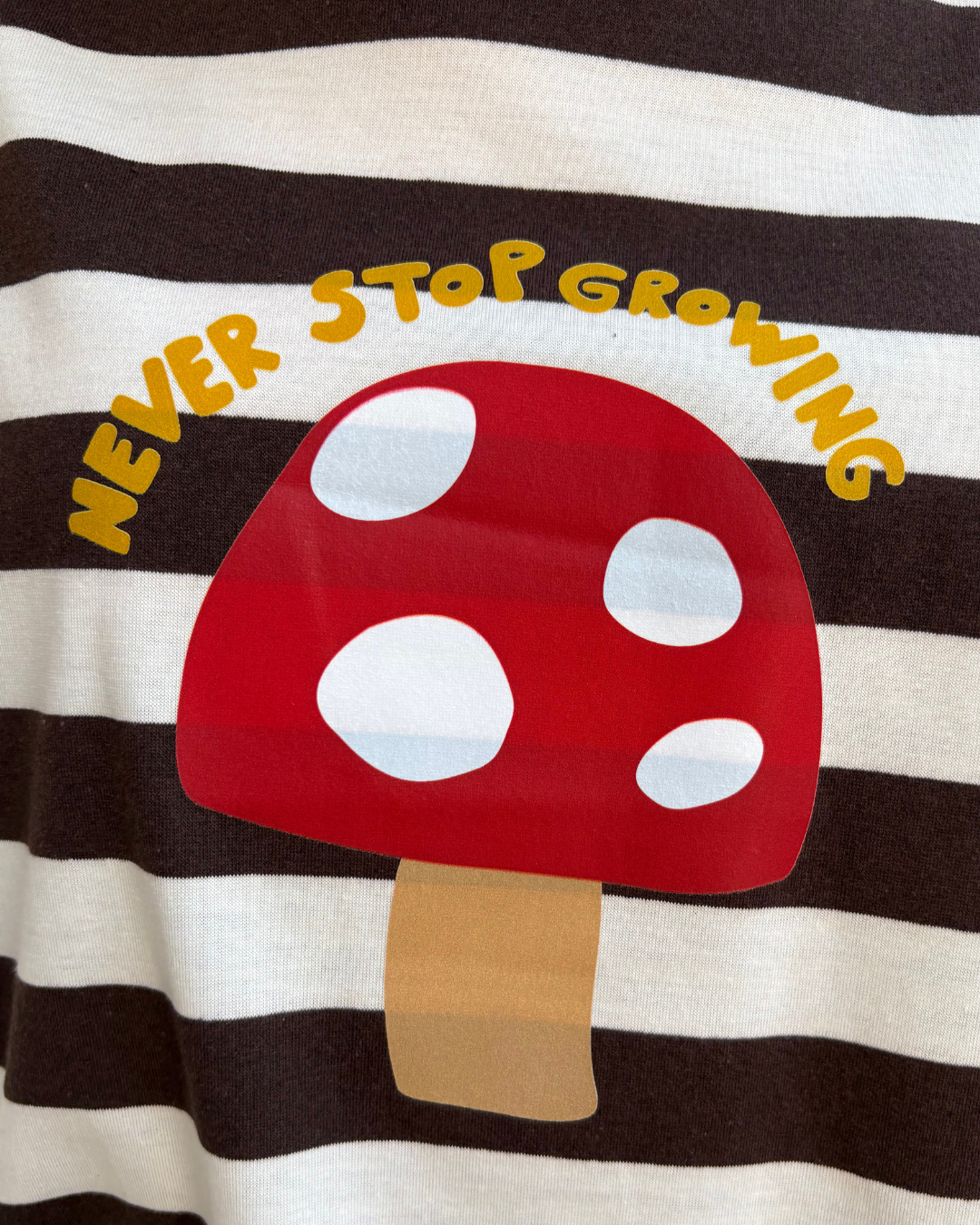 T-shirt “never stop growing”